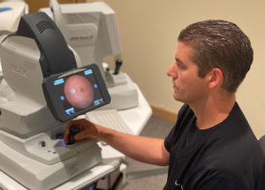 dr david johnson working eye exam machine