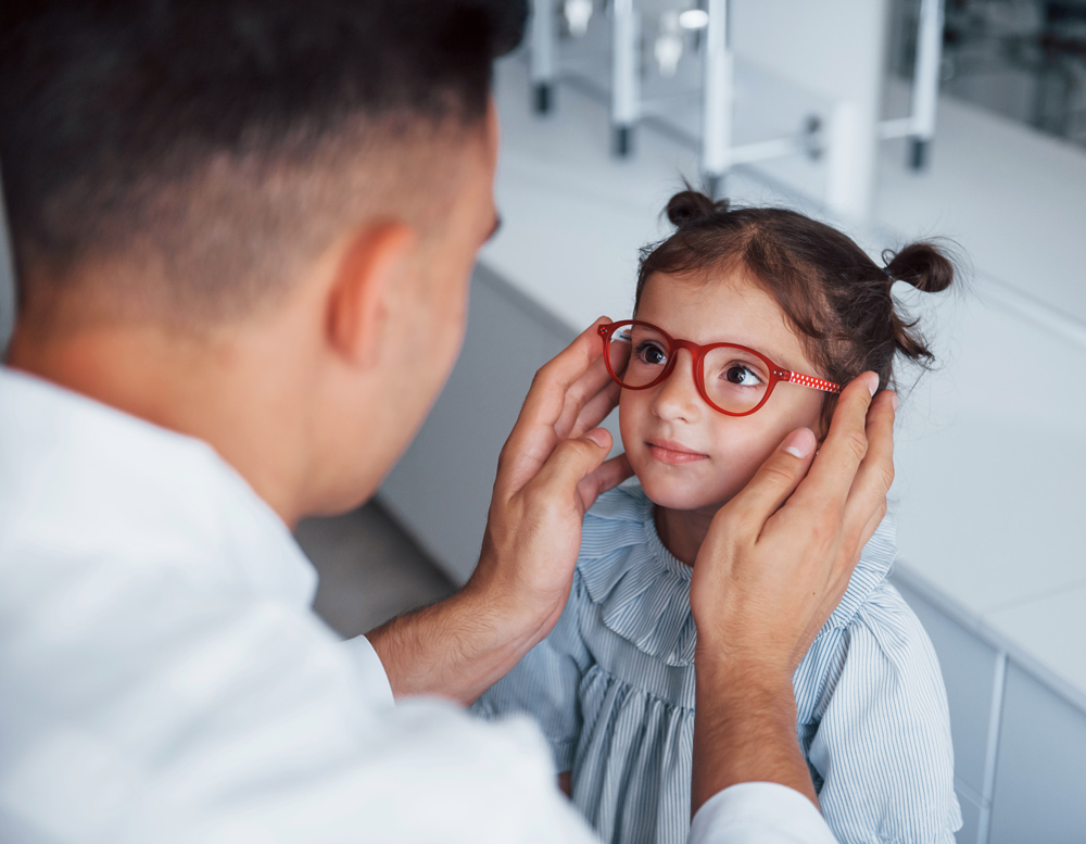 cute little girl getting glasses